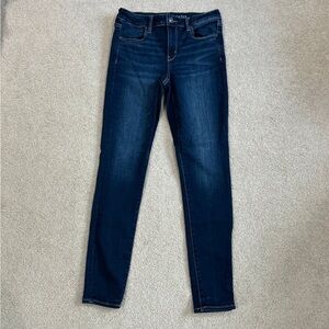 American eagle next level stretch dark wash solid blue jeans in size 10 long